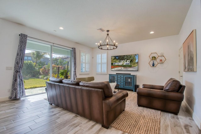 living room featuring an inviting chandelier