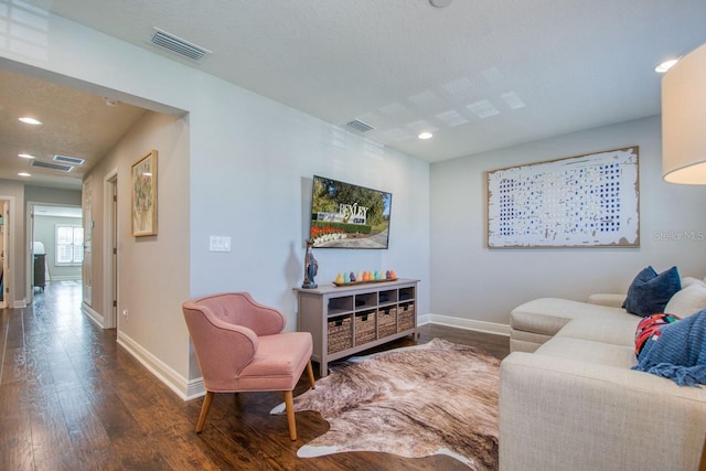 living room with dark hardwood / wood-style floors