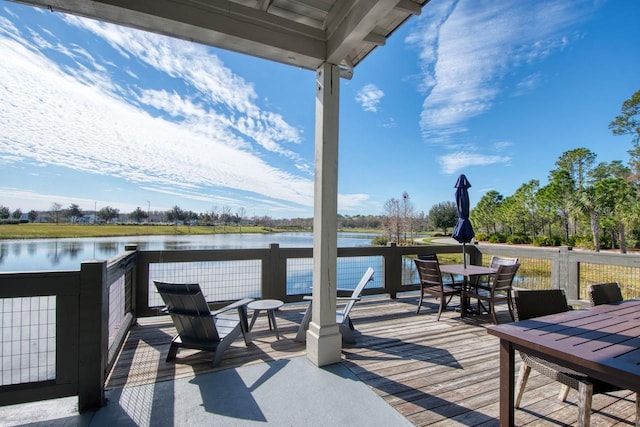 wooden terrace with a water view