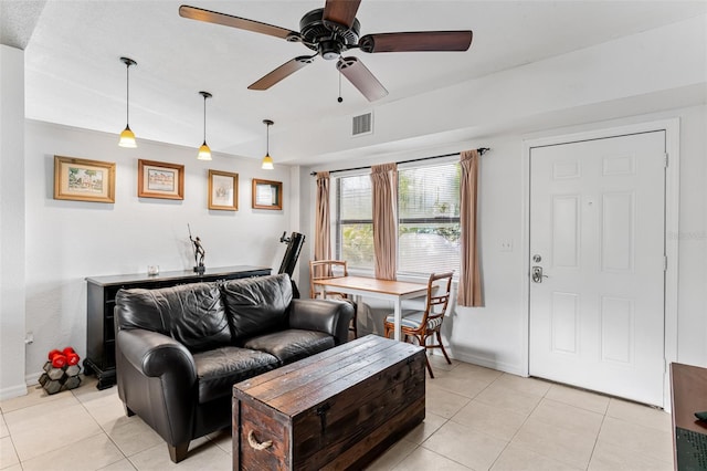 living room featuring ceiling fan and light tile patterned flooring