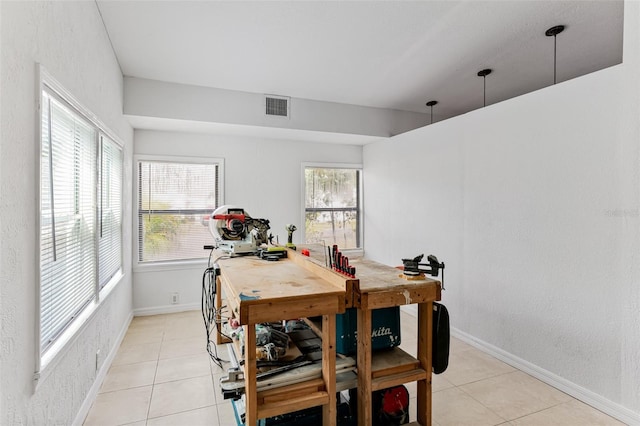 tiled dining room with a wealth of natural light