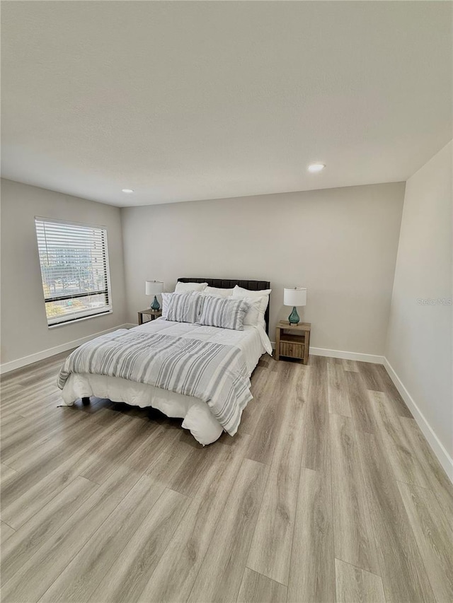 bedroom featuring light hardwood / wood-style floors