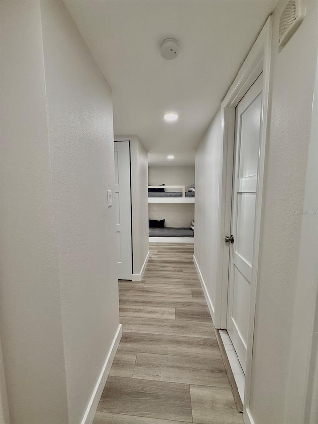 corridor featuring light hardwood / wood-style flooring