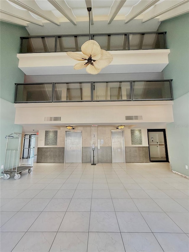 interior space featuring a towering ceiling