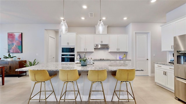 kitchen with white cabinetry, hanging light fixtures, black appliances, and a center island