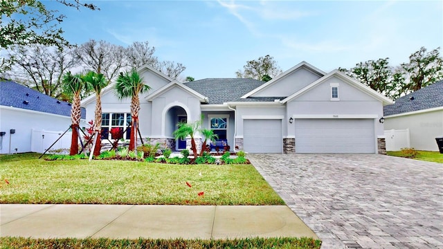 view of front of house with a garage and a front yard