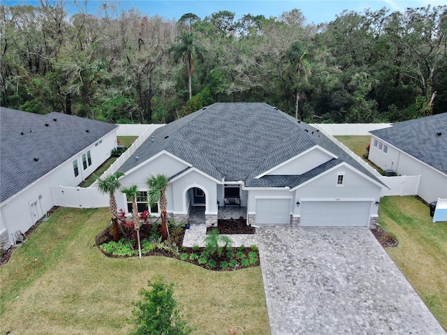 view of front of home with a garage and a front yard