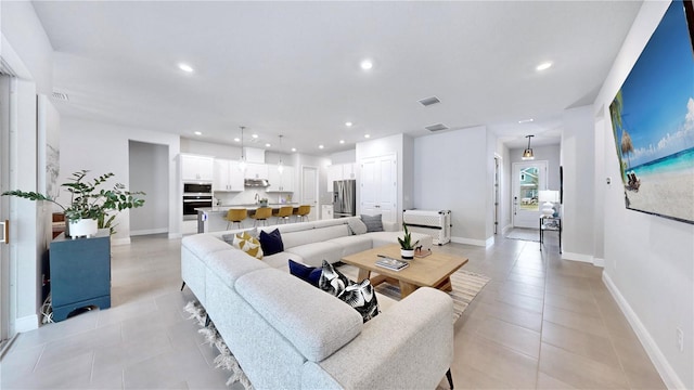 living room featuring light tile patterned floors