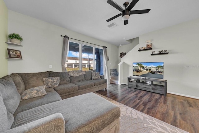 living room with dark hardwood / wood-style flooring and ceiling fan