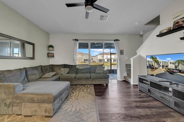 living room with ceiling fan and dark hardwood / wood-style flooring