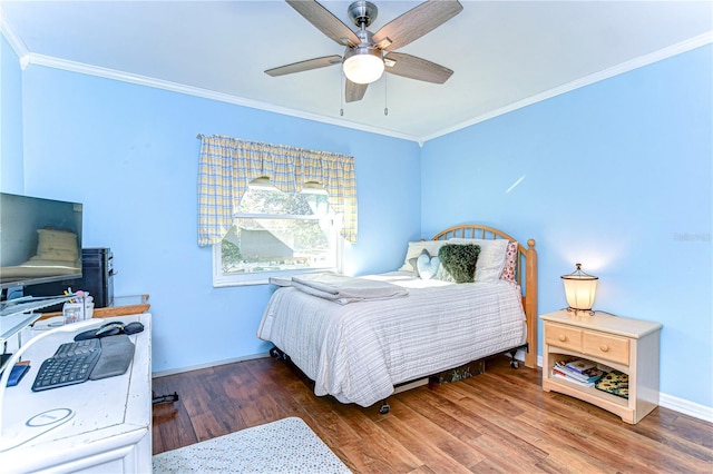 bedroom with crown molding, ceiling fan, and wood-type flooring