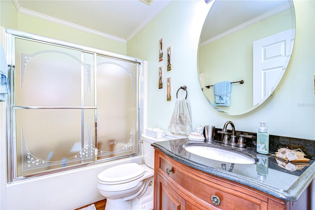 full bathroom with enclosed tub / shower combo, crown molding, vanity, and toilet