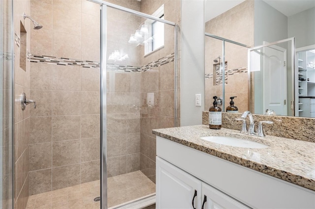 bathroom with vanity and an enclosed shower