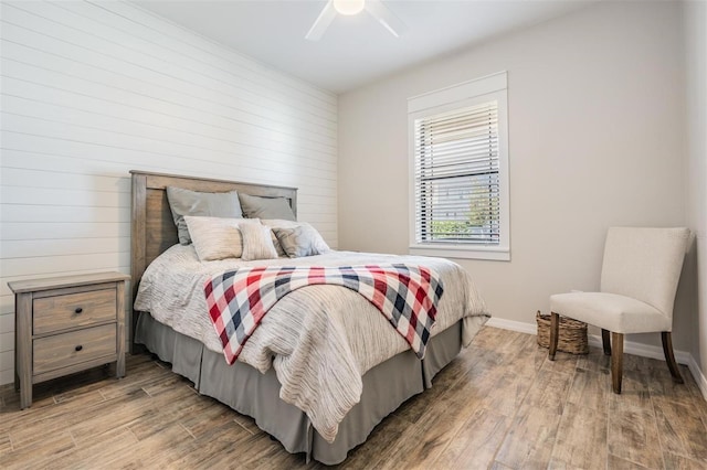 bedroom featuring hardwood / wood-style flooring and ceiling fan