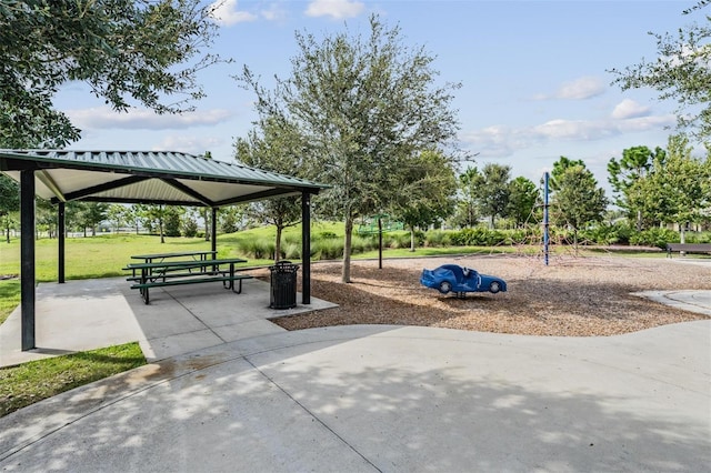 view of community with a gazebo, a lawn, and a playground