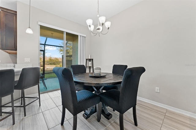 dining space with a chandelier