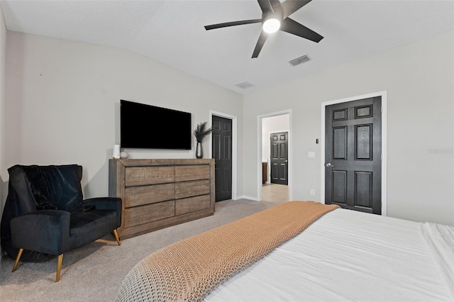 bedroom with lofted ceiling, light colored carpet, and ceiling fan