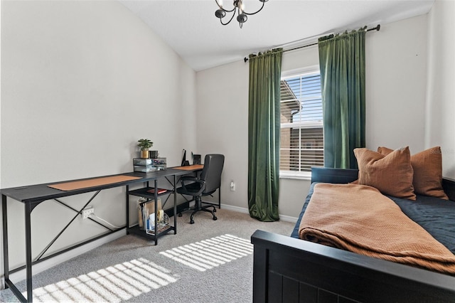 carpeted bedroom with vaulted ceiling and an inviting chandelier