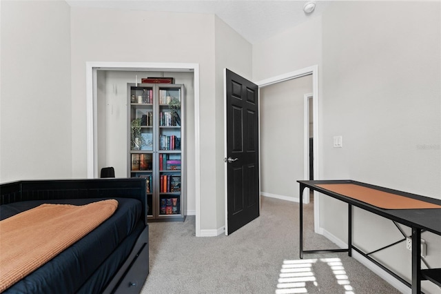 bedroom featuring light colored carpet