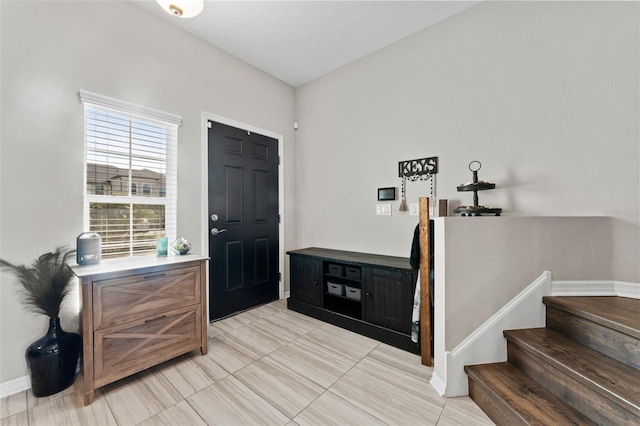 29913 Southwell Ln, Wesley Chapel, FL 33543 - foyer featuring baseboards, stairs, and light tile patterned flooring