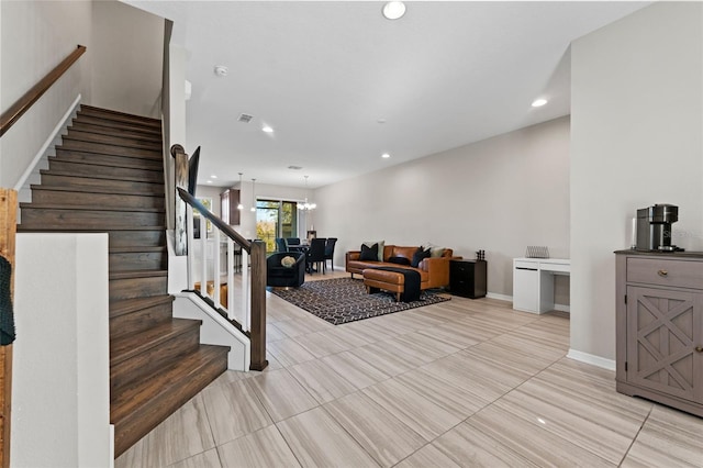 29913 Southwell Ln, Wesley Chapel, FL 33543 - stairs with tile patterned flooring, recessed lighting, and a chandelier