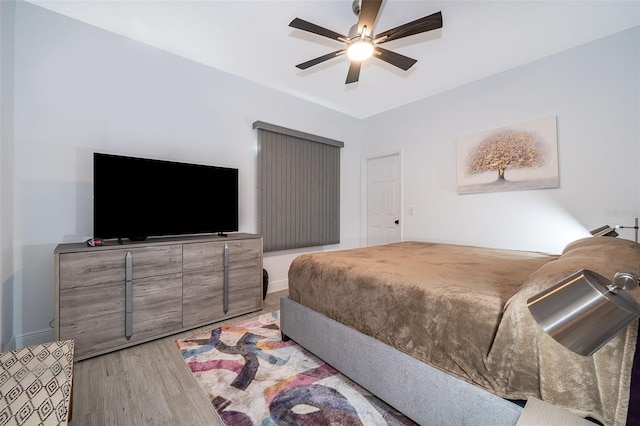 bedroom featuring light hardwood / wood-style floors and ceiling fan