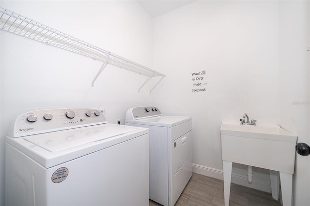 clothes washing area with washer and dryer