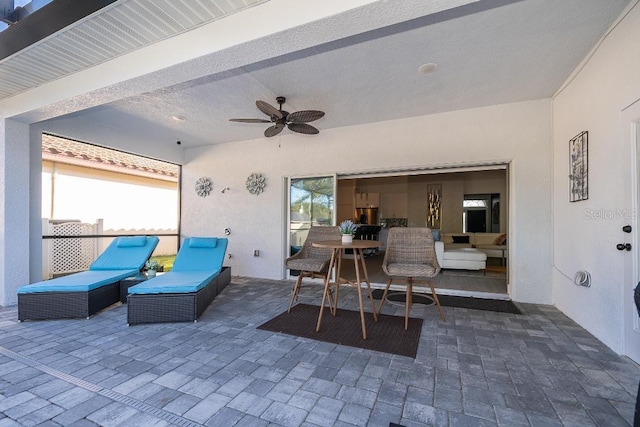 view of patio / terrace featuring ceiling fan