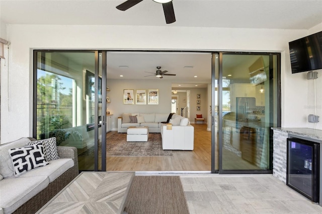 living room featuring light wood-type flooring and beverage cooler