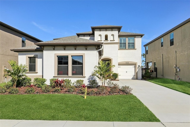 prairie-style house with roof with shingles, stucco siding, concrete driveway, an attached garage, and a front lawn