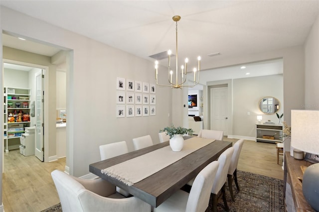 dining room with visible vents, baseboards, light wood-type flooring, a notable chandelier, and recessed lighting