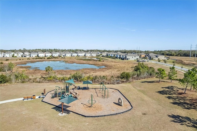 drone / aerial view with a water view and a residential view