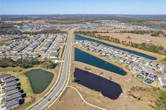 aerial view featuring a residential view and a water view