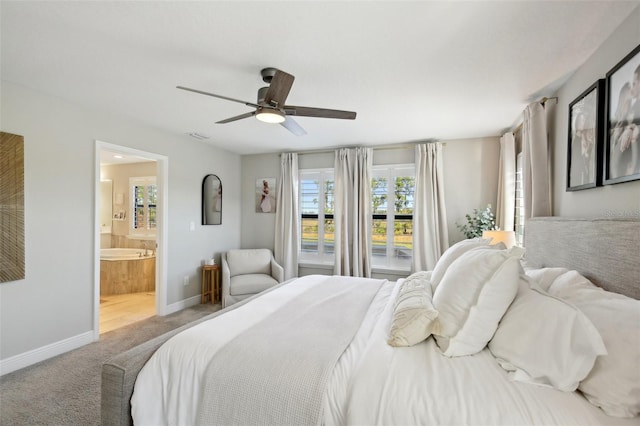 bedroom with visible vents, baseboards, carpet floors, ceiling fan, and ensuite bathroom