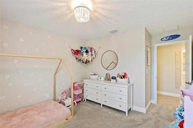 bedroom featuring light colored carpet, visible vents, a chandelier, and baseboards