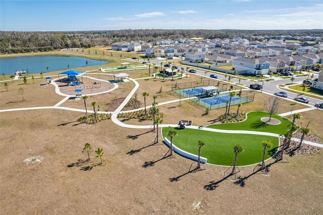 bird's eye view featuring a water view and a residential view