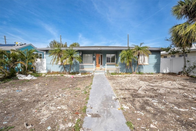 single story home with covered porch