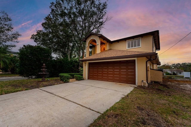 property exterior at dusk with a garage