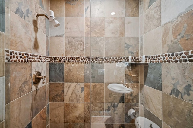 bathroom with tiled shower