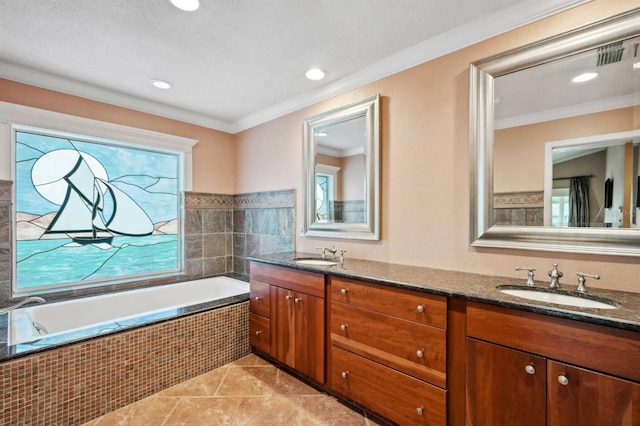 bathroom featuring crown molding, tile patterned floors, tiled bath, and vanity