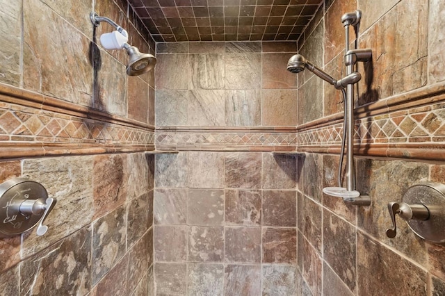 bathroom with a tile shower