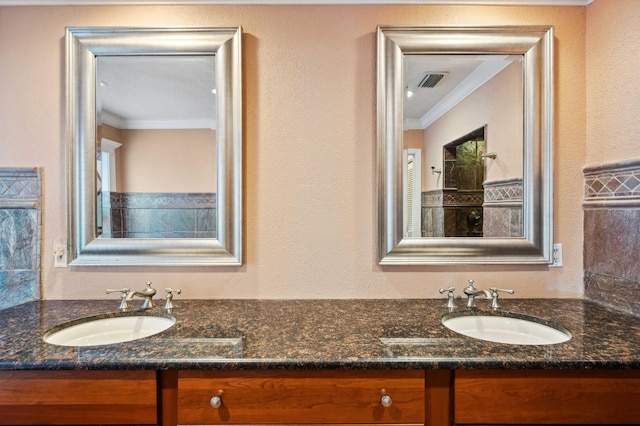 bathroom with vanity and ornamental molding