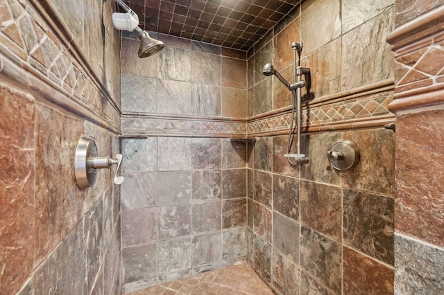 bathroom with a tile shower