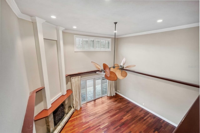 interior details with hardwood / wood-style floors and crown molding