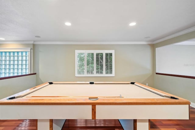 recreation room with crown molding, pool table, and dark wood-type flooring