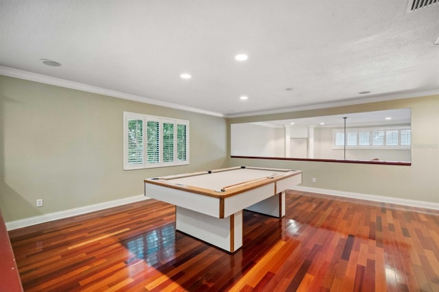 game room with billiards, ornamental molding, and dark hardwood / wood-style flooring