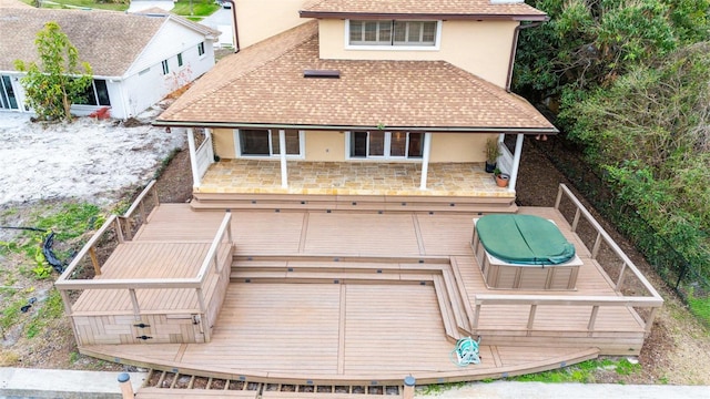 rear view of house featuring a deck