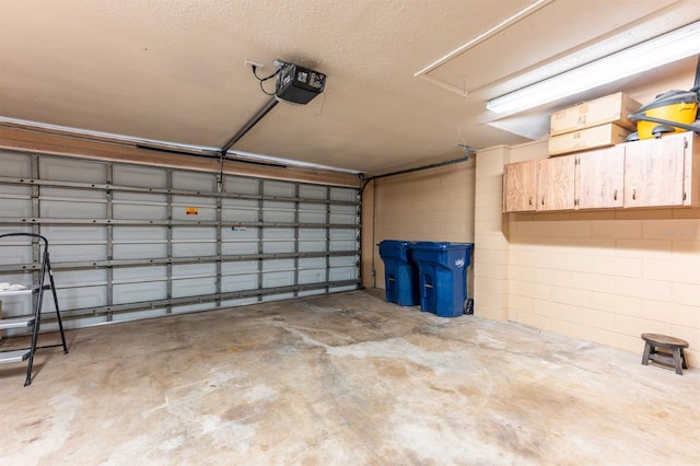 garage featuring a garage door opener