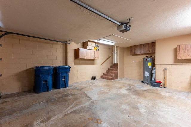 garage with a garage door opener and electric water heater