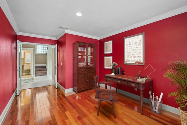 office area featuring wood-type flooring and crown molding